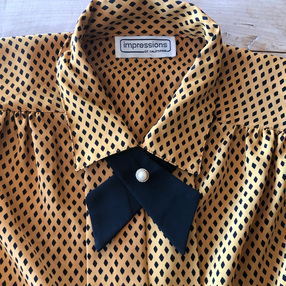 Vintage blouse, button up with great details.